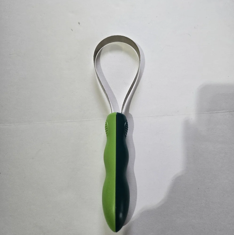 Green and Silver Grooming Tool